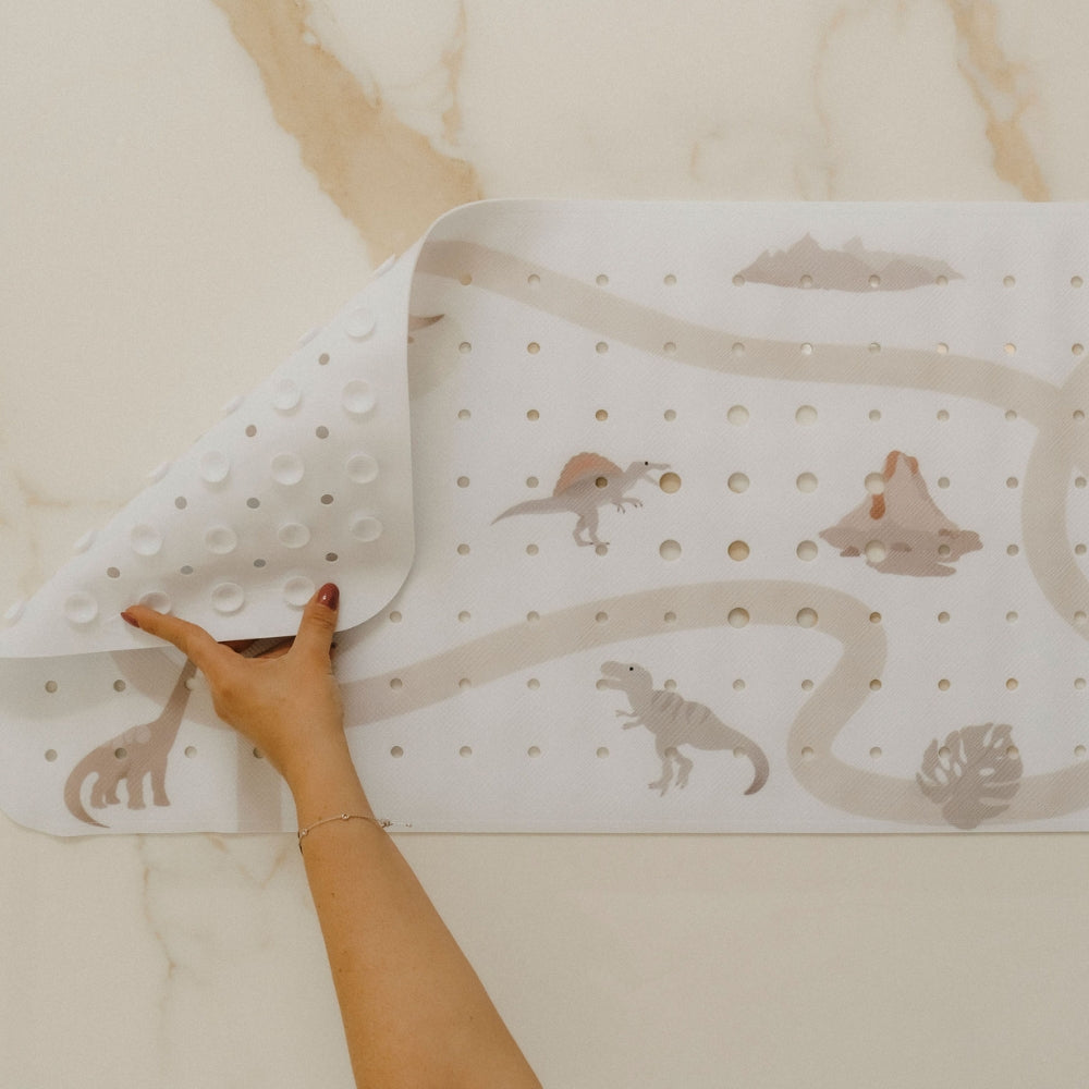 tapis de bain motif dinosaure avec vue des ventouses à l'arrière