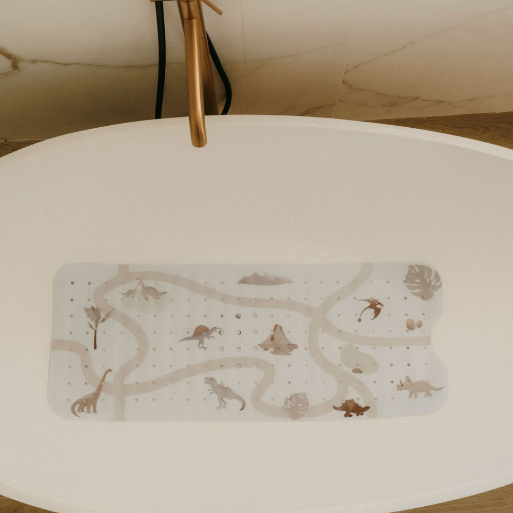 tapis de bain le dino exposé dans la baignoire