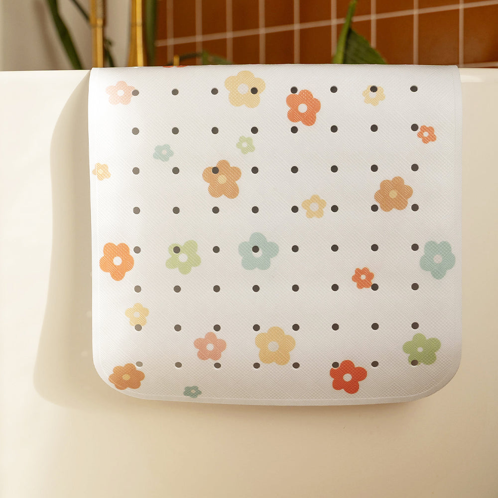tapis de bain motif fleur tapilou posé sur une baignoire