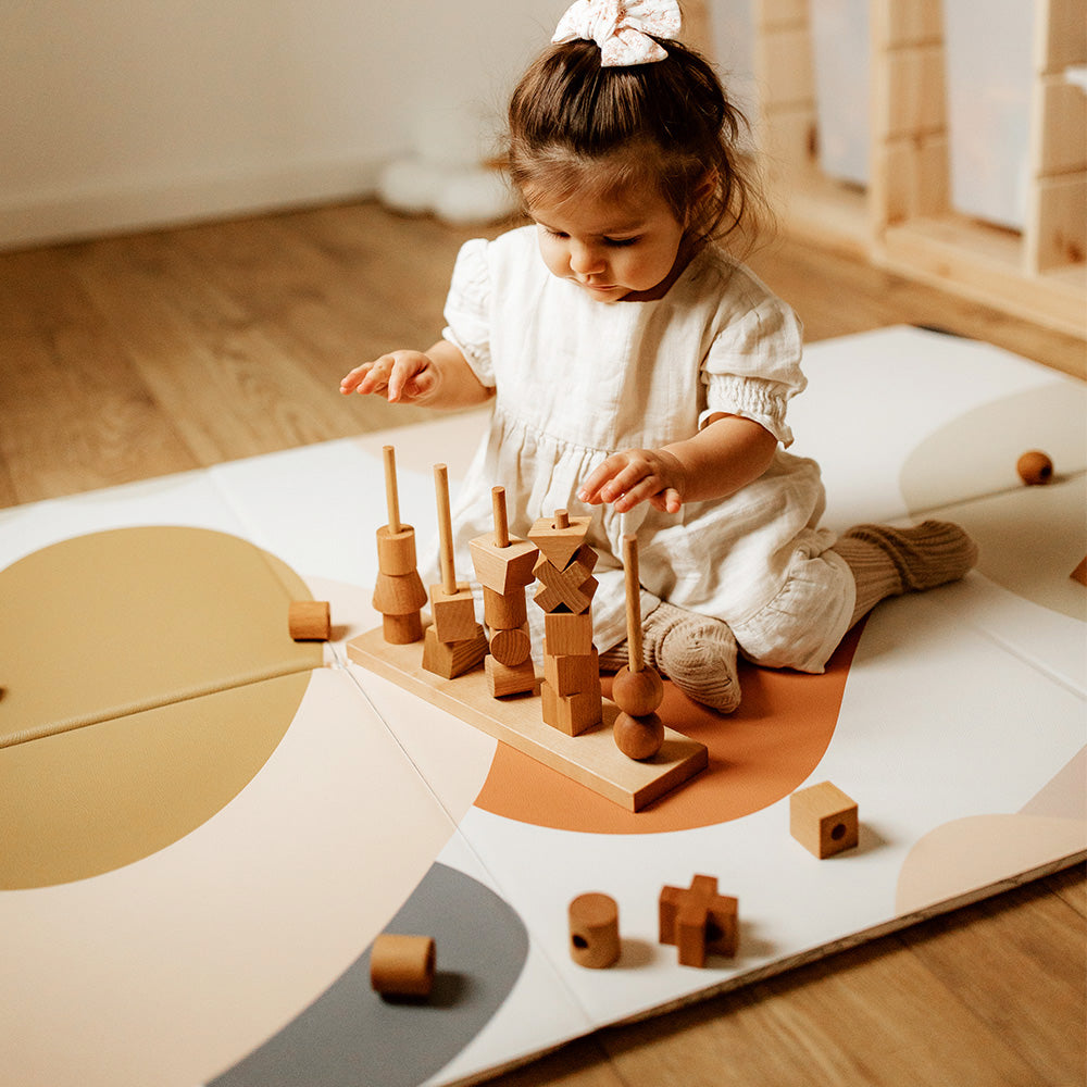 enfant qui joue sur le tapis de jeu pliable le bubulle